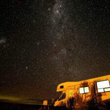 RV / Caravan parked under starry sky