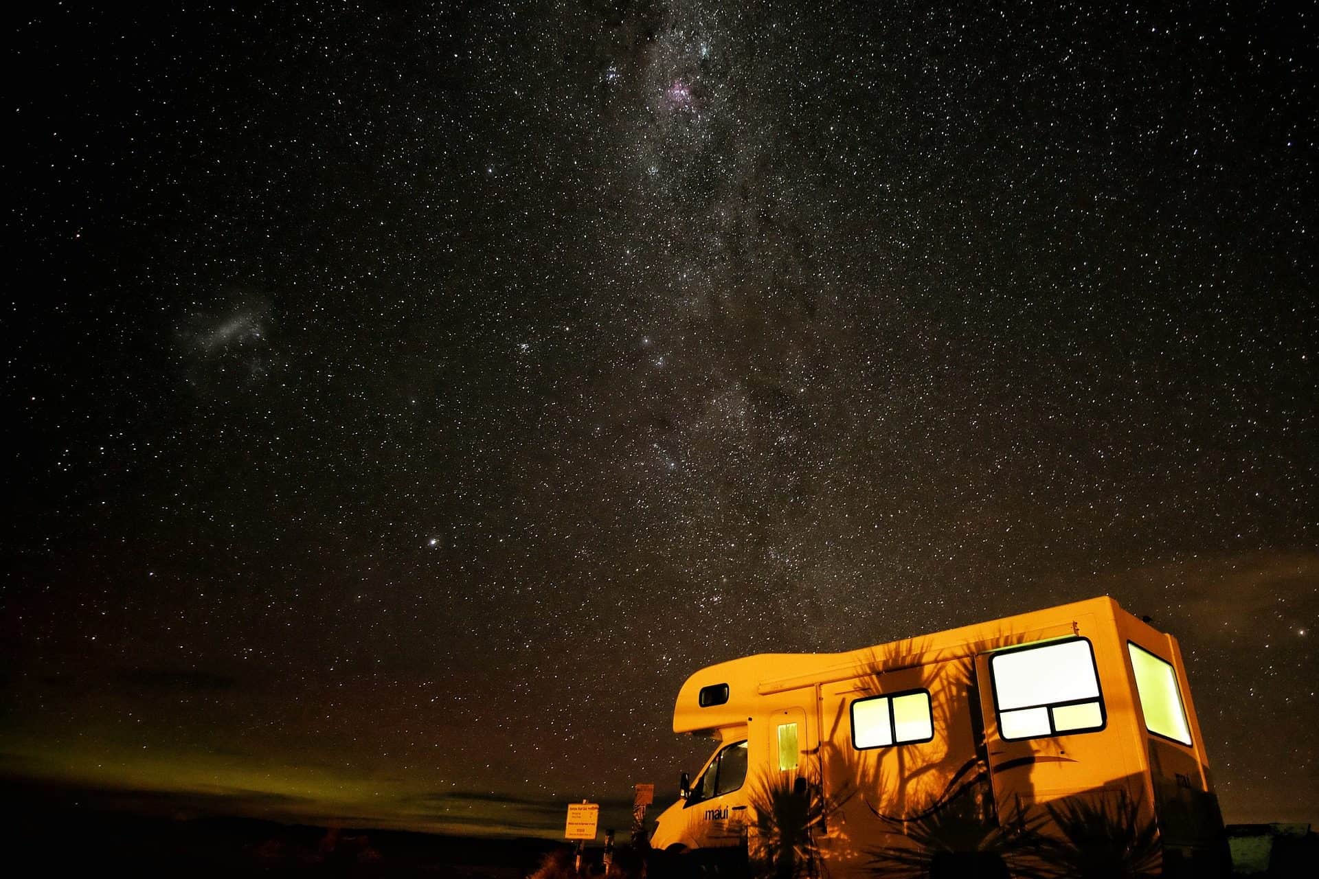 RV / Caravan parked under starry sky